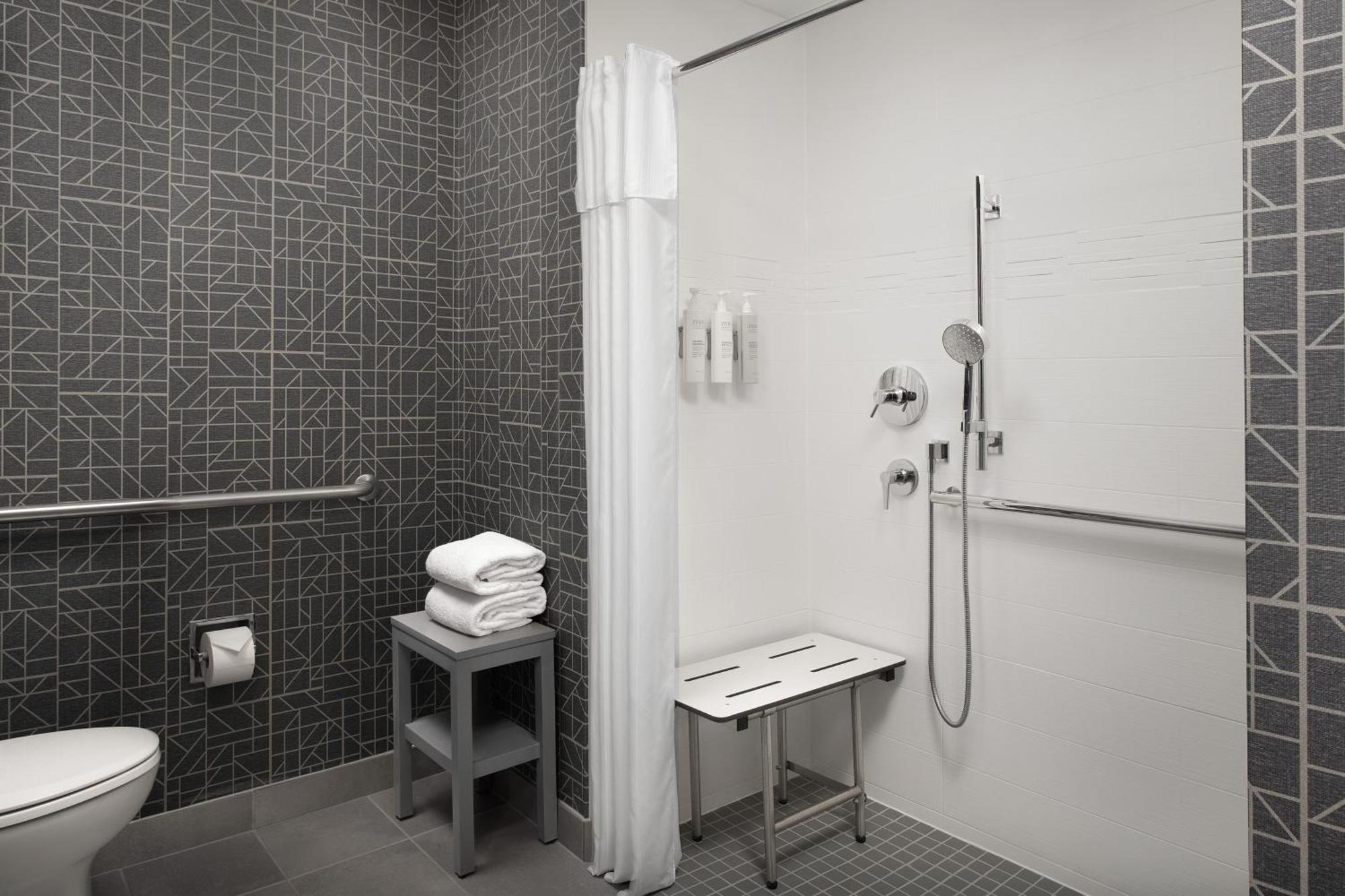 King Suite Roll Shower – Mobility Hearing Accessible